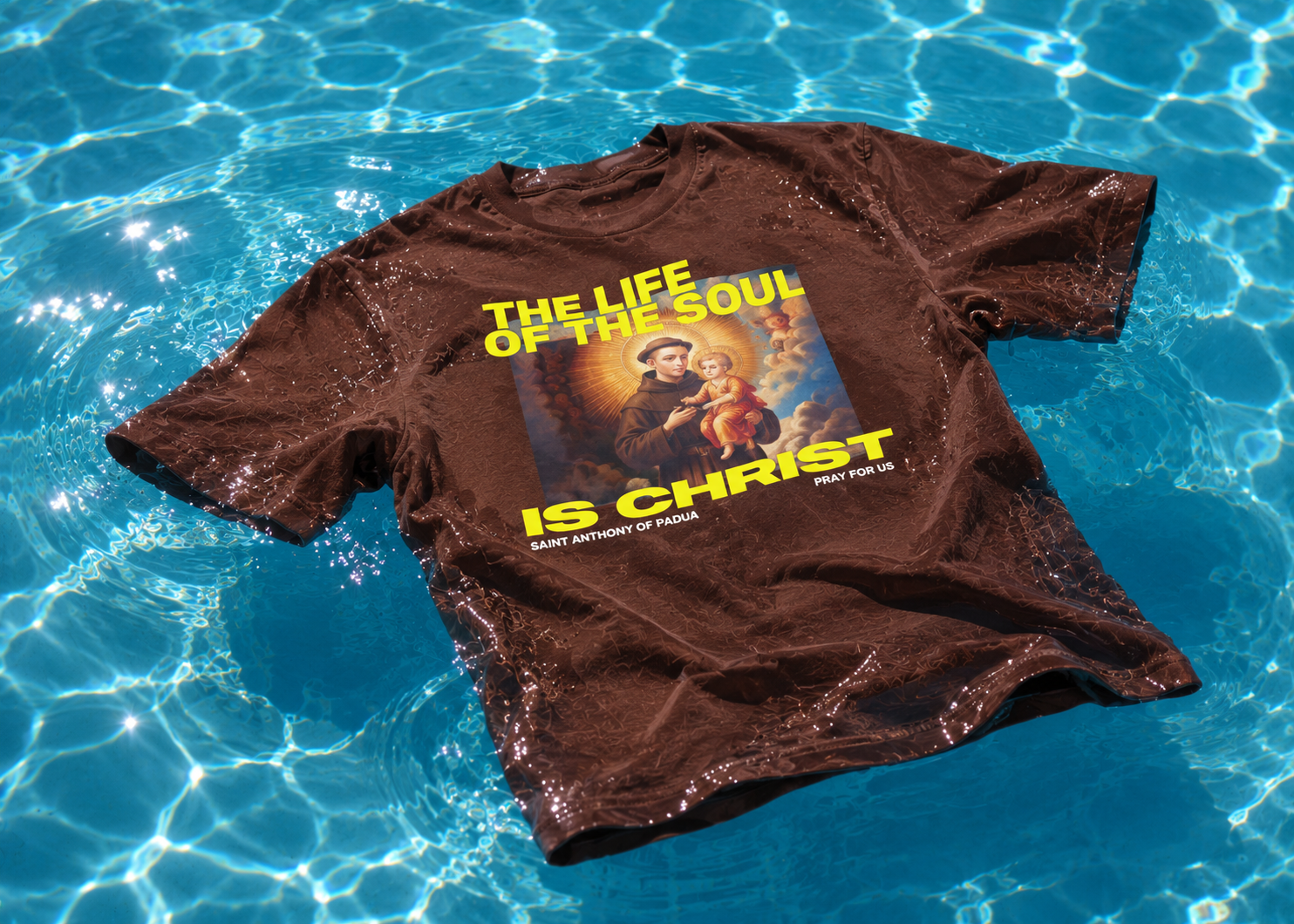 Brown t-shirt with graphic design on a blue water background